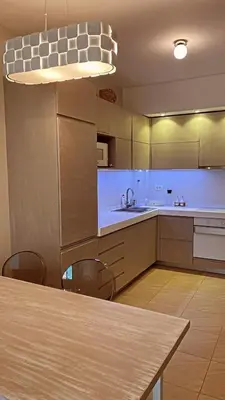 a kitchen with a table and some chairs and a sink at Ekaterina1-KS in Becici
