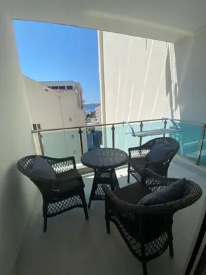 a balcony with four chairs and a table on a ship at Ekaterina1-KS in Becici