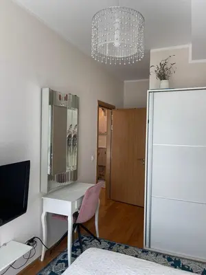 a room with a white desk and a white refrigerator at Ekaterina2BD in Becici