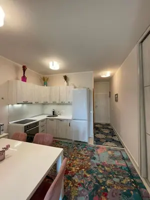 a kitchen with a white refrigerator and a table at Ekaterina2BD in Becici