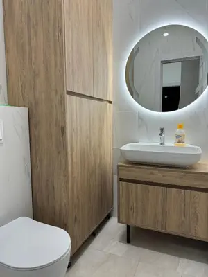 a bathroom with a sink and a toilet and a mirror at Ekaterina3VA in Becici