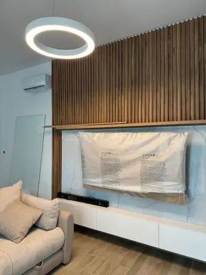 a living room with a couch and a light fixture at Ekaterina3VA in Becici
