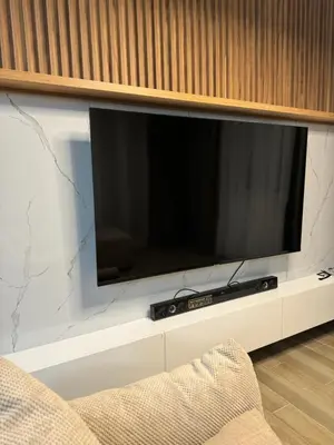 a flat screen tv sitting on a wall at Ekaterina3VA in Becici