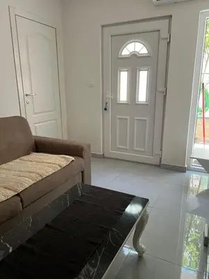 a living room with a couch and a door at Nelaa in Sutomore