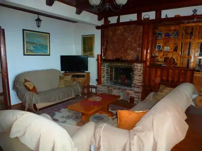 a living room with a couch and a fireplace at Apartment Djakonovic Mladen in Ulcinj
