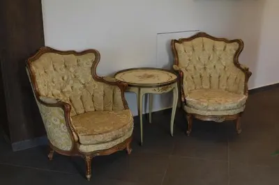 two chairs and a table and a table and a table and chairs at Hotel Opera Jaz in Budva