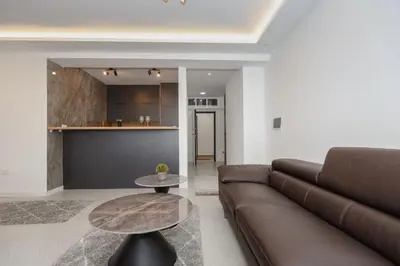 a living room with a couch and a table at B1 first line apartments in Bar, Susanj