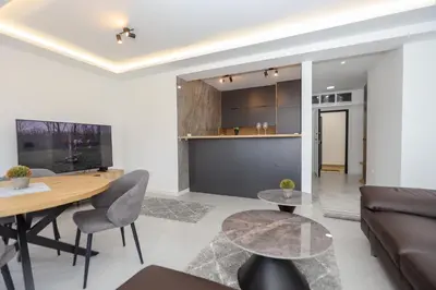 a living room with a couch and a table at B1 first line apartments in Bar, Susanj