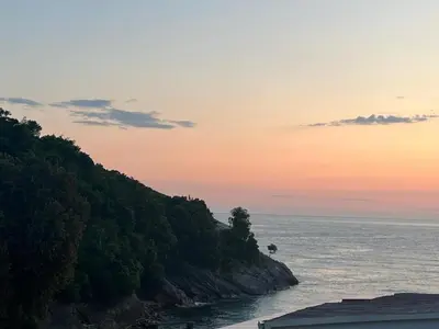 a view of the ocean at sunset at Rasi Sea Side Villa in Ulcinj