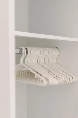 a closet with white shelving in a room at Big Family apartment - 3BR in Budva