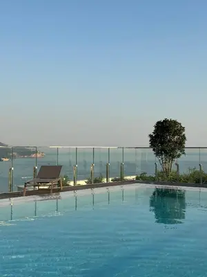 a large swimming pool with a view of the water at Vuelo Sobre Bečići in Becici