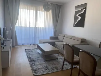 a living room with a couch and a table at Vuelo Sobre Bečići in Becici