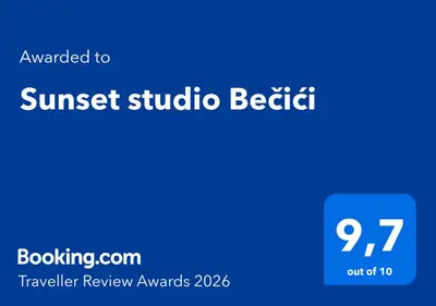 a blue sign that reads sunset studio beettle at Sunset studio Bečići in Becici