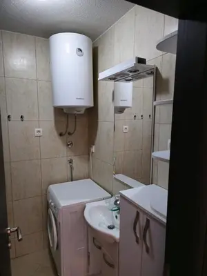 a small bathroom with a sink and a mirror at Omega 2 Apartment Budva in Budva