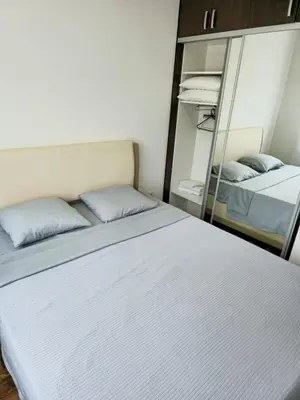a bedroom with two beds and a mirror at Omega 3 Apartment Budva in Budva