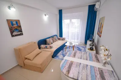 a living room with a couch and a table at DaSU 1 CENTAR in Bar