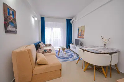 a living room with a couch and a table at DaSU 1 CENTAR in Bar