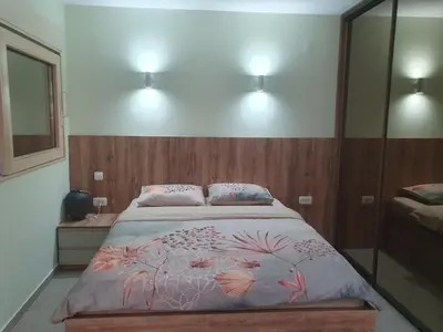 a bed in a bedroom with two pillows on it at LucaSa Apartment in Kotor