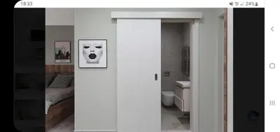 a bathroom with a picture of a dog on the wall at LucaSa Apartment in Kotor