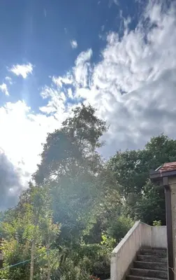 a large mountain with stairs in front of a sky at APARTMENTS Mir in Virpazar