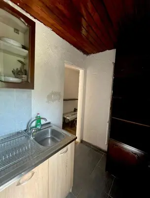 a kitchen with a sink and a counter top at APARTMENTS Mir in Virpazar