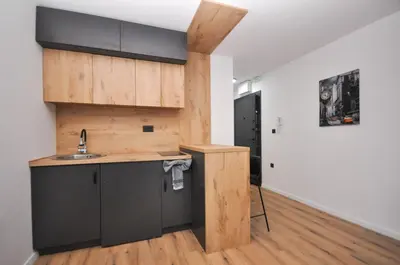 a kitchen with a sink and a counter top at Studio Dobra Voda 14 in Bar