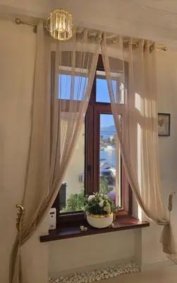 a window with a potted plant on a window sill at The Queen of Boka in Kotor