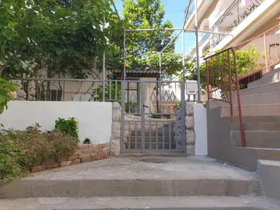 an entrance to a building with a gate at Kiwi in Ulcinj