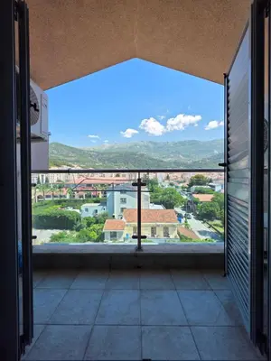 a balcony with a view of a city at G apartment city centre Budva in Budva