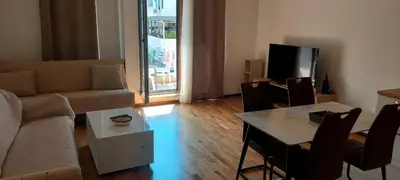 a living room with a couch and a table at Seaside Milena Appartment in Budva