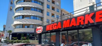 a sign for a nissan marina in front of a building at Seaside Milena Appartment in Budva