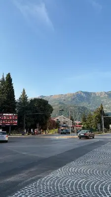 a street with cars driving down a road at Seaside Milena Appartment in Budva