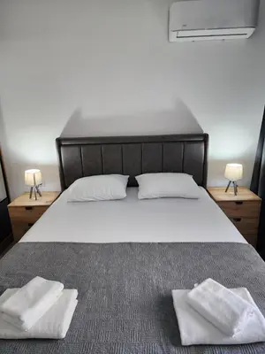 a bedroom with a bed with two towels on it at Morning star in Ulcinj