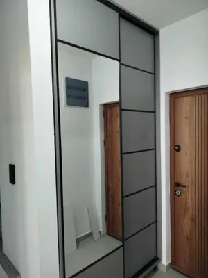 a large mirror in a room with a door at Morning star in Ulcinj