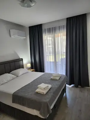 a bedroom with a bed with two towels on it at Morning star in Ulcinj
