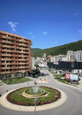 a street in a city with a large building at TehnomaX in Budva