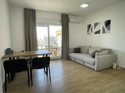 a living room with a couch and a table at TehnomaX in Budva