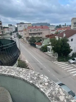 a view of a city street from a balcony at Green square apartment Budva in Budva