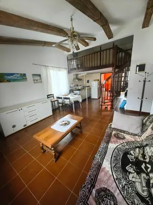 a living room with a couch and a table at Cozy duplex in Sutomore in Sutomore