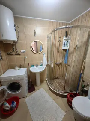 a bathroom with a shower and a toilet and a sink at Cozy duplex in Sutomore in Sutomore