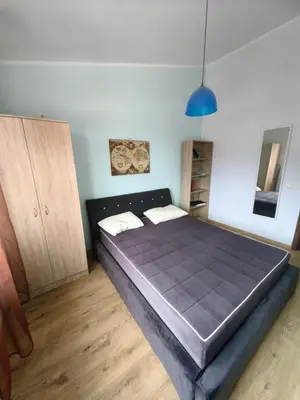 a bedroom with a large bed in a room at Cozy duplex in Sutomore in Sutomore