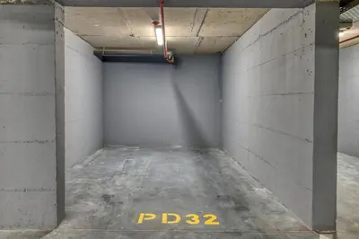 an empty room with a concrete wall at Twin Towers LT Luxury in Becici