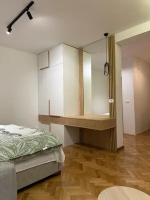 a bedroom with a bed and a mirror in it at Villa Firenze in Ulcinj