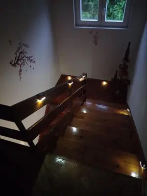 a staircase in a room with lights on it at Relax Hostel Bar in Podgorica