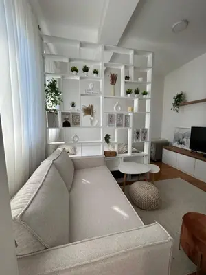 a living room with a couch and a table at Studio Soleil in Cetinje