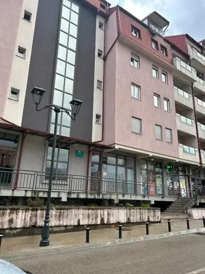 a large building with a street light in front of it at Studio Soleil in Cetinje