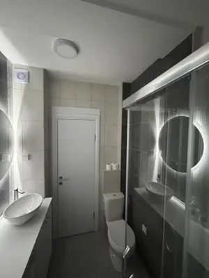a bathroom with a toilet and a sink and a mirror at Studio Soleil in Cetinje