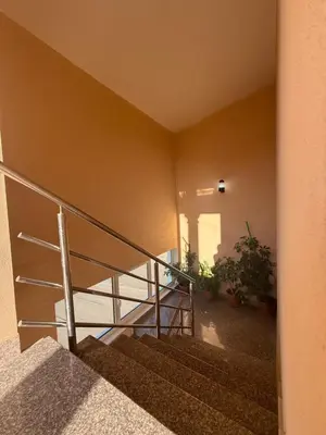 a staircase with a metal railing and a stair case at Apartments George in Ulcinj