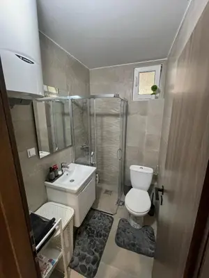 a bathroom with a toilet and a shower and a sink at Apartmani Petrovac in Petrovac na Moru
