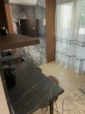 a meeting room with a table and a television at Apartmani Petrovac in Petrovac na Moru